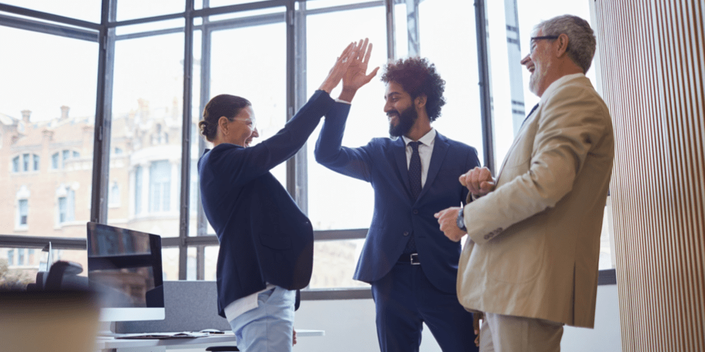 Office Gadgets to Enhance Your Workspace Productivity 8 Happy team meeting hi5