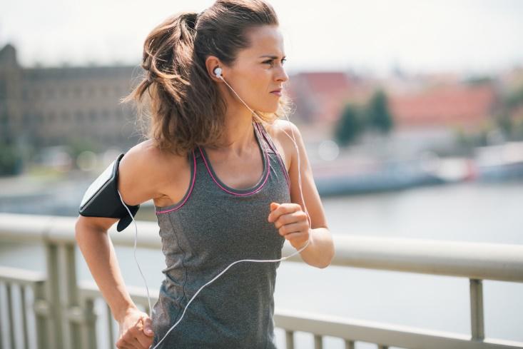 How to Keep On Track With Your Health Goals During a Pandemic 2 Woman running outside Luxafor