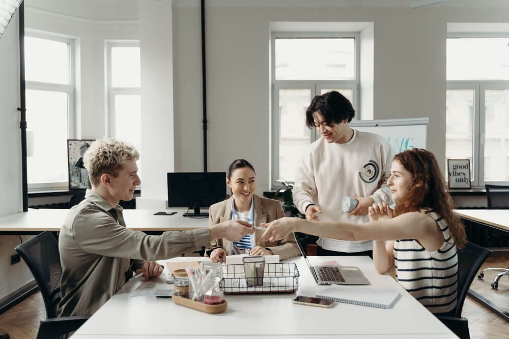 Workflow management for team leaders — what is it and how does it work? 3 Team working together - Luxafor