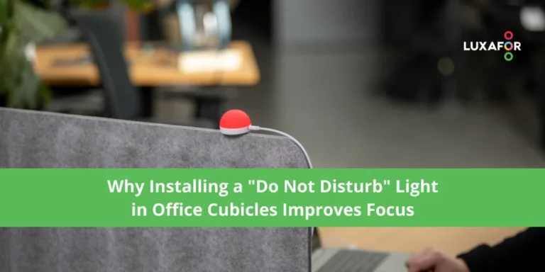 Red do not disturb light for office on a desk in an office cubicle showing the user is in focus mode